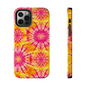 May include: A phone case with a bright yellow and pink tie-dye pattern. The case has a cutout for the camera lens.