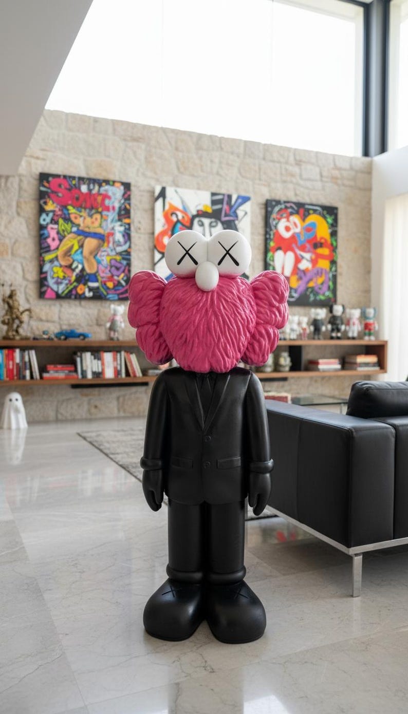 May include: A large black sculpture of a figure in a suit with a pink, furry head and white eyes with black X's. The sculpture is standing in a modern living room with colorful artwork and a black leather sofa.
