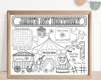 May include: Black and white printable activity sheet for a 1st birthday party with a circus theme. The sheet includes a word search, a count the stars game, a find the ticket maze, and a tic-tac-toe game. The text "Jack's 1st Birthday" is at the top of the sheet.
