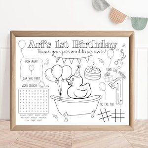 May include: Black and white printable birthday party activity sheet with a duck in a bathtub, balloons, a cake, a number one maze, and a tic-tac-toe game. The text says "Ari's 1st Birthday" and "Thank you for waddling over!"
