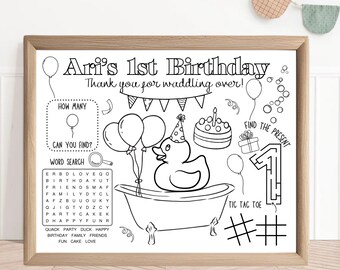 May include: Black and white printable birthday party activity sheet with a duck in a bathtub, balloons, a cake, a number one maze, and a tic-tac-toe game. The text says "Ari's 1st Birthday" and "Thank you for waddling over!"