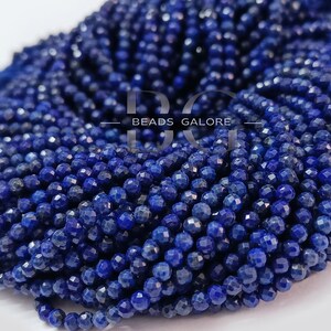 May include: A strand of deep blue lapis lazuli beads, each bead is faceted and measures approximately 4mm in diameter. The beads are strung on a clear thread and are ready to be used for jewelry making.