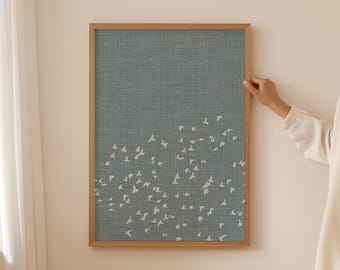 May include: A rectangular wall art print in a light wood frame featuring a textured slate blue background with a pattern of small white birds flying in a scattered formation across the lower two-thirds of the vertical composition.