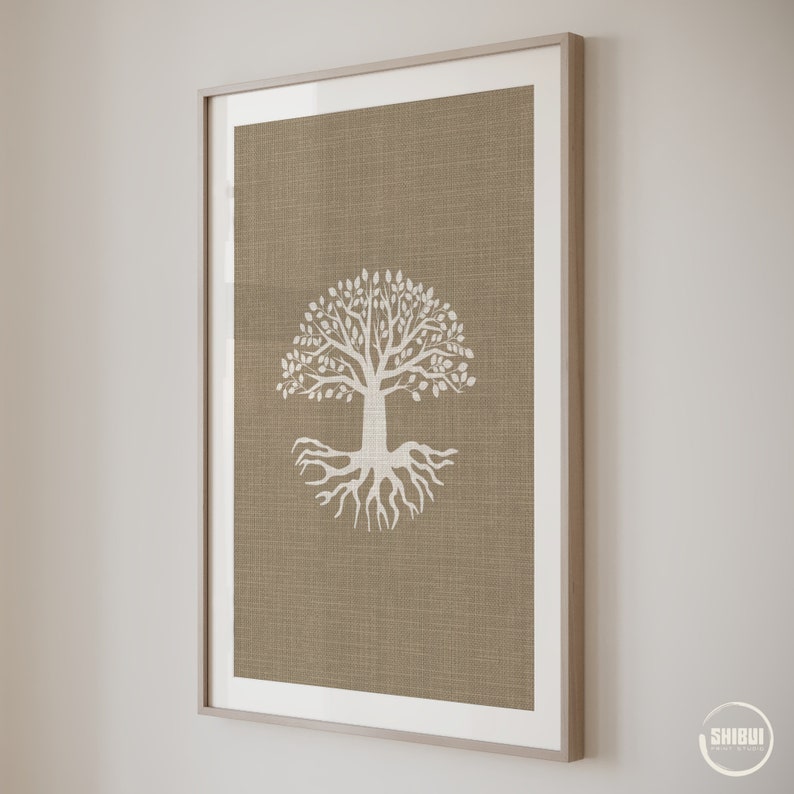 May include: A framed print of a white tree with roots on a brown burlap background.