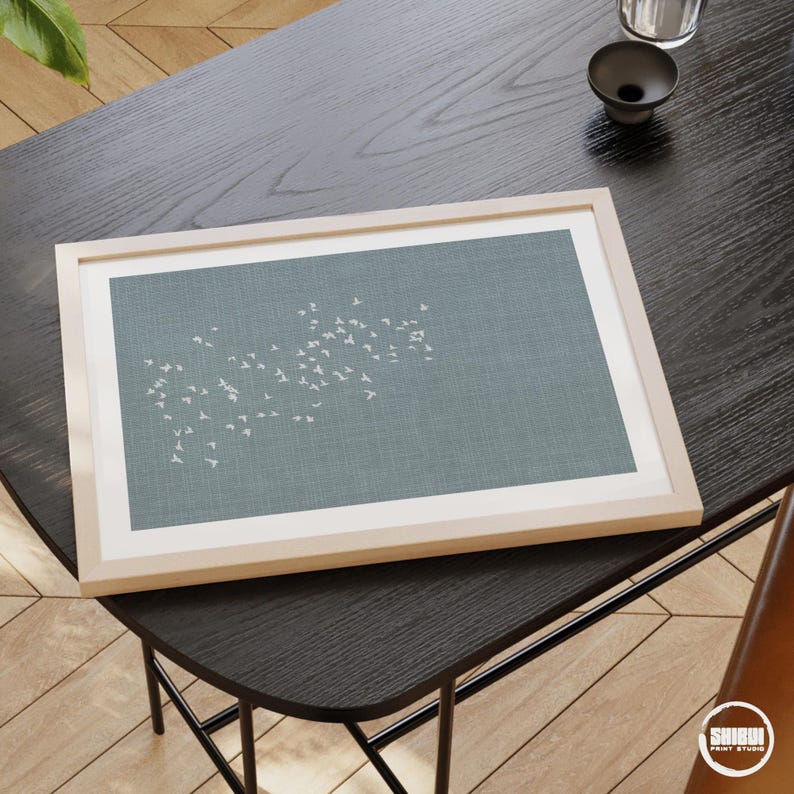 Horizontal art print displayed in minimalist office.