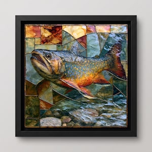 May include: A square framed wall art piece featuring a mosaic-style depiction of a brook trout. The fish displays mottled green, orange, and yellow scales with red spots, set against a background of geometric glass-like shards in earthy tones.