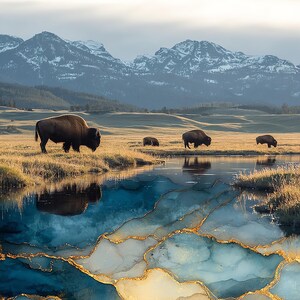May include: A landscape scene featuring four dark brown bison grazing in a grassy field near a stream. The foreground water transitions into a blue and white marble-like texture with gold veins. Snow-capped mountains rise in the background.