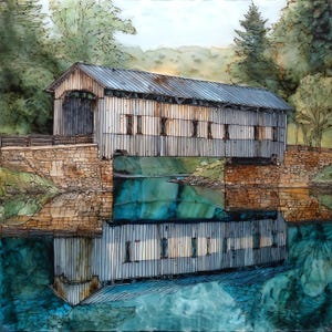 May include: An alcohol ink painting of a wooden covered bridge with vertical siding and a metal roof, set upon stone abutments above a calm body of water. The scene includes a clear reflection of the bridge in the water and lush green trees.
