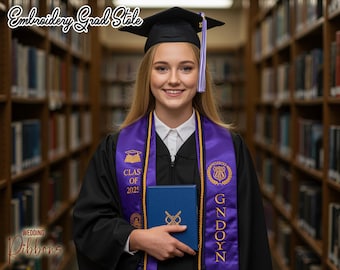 May include: A smiling person wearing a black graduation gown, cap, and a purple and gold embroidered stole. The stole has the text "CLAS OF 2025" and "GNDOYN". The person is holding a blue diploma case. The image is in a library.