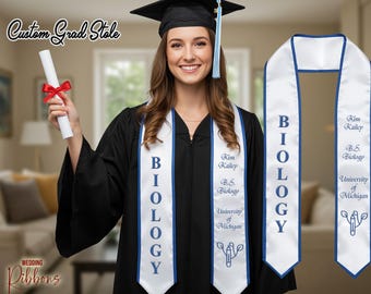 May include: A graduate wearing a black cap and gown, holding a diploma tied with a red ribbon. The white graduation stole has blue trim and the word "BIOLOGY" printed on it. The stole also includes the graduate's name, degree, and university.