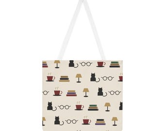May include: A cream-coloured tote bag featuring a repeating pattern of black cat silhouettes, stacks of colourful books, brown table lamps, pairs of round eyeglasses, and red coffee mugs with steam rising from them, complete with two white straps.