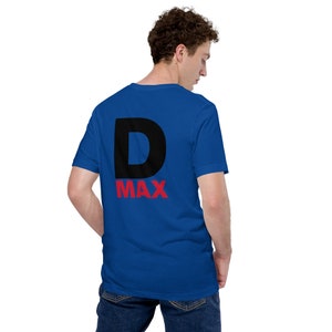 May include: Royal blue t-shirt with a large black "D" and the word "MAX" in red. The shirt is made of a soft material and has a classic crew neck design. The back of the shirt is visible in the image.