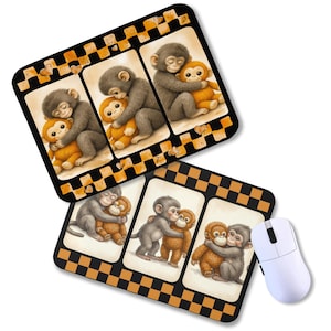 May include: Two mouse pads with a repeating design of a black and orange checkered border. Each pad features three panels with illustrations of gray monkeys hugging orange monkeys. A white computer mouse is next to one of the mouse pads.