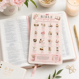 May include: A Bible Emergency Guide card with a light pink background, floral accents, and a grid of thematic illustrations with corresponding Bible verses. The card features text including "BIBLE EMERGENCY GUIDE" and "A PRAYER FOR EVERY MOMENT" printed in black and pink ink, resting on an open Bible.