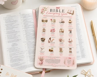 May include: A Bible Emergency Guide card with a light pink background, floral accents, and a grid of thematic illustrations with corresponding Bible verses. The card features text including "BIBLE EMERGENCY GUIDE" and "A PRAYER FOR EVERY MOMENT" printed in black and pink ink, resting on an open Bible.