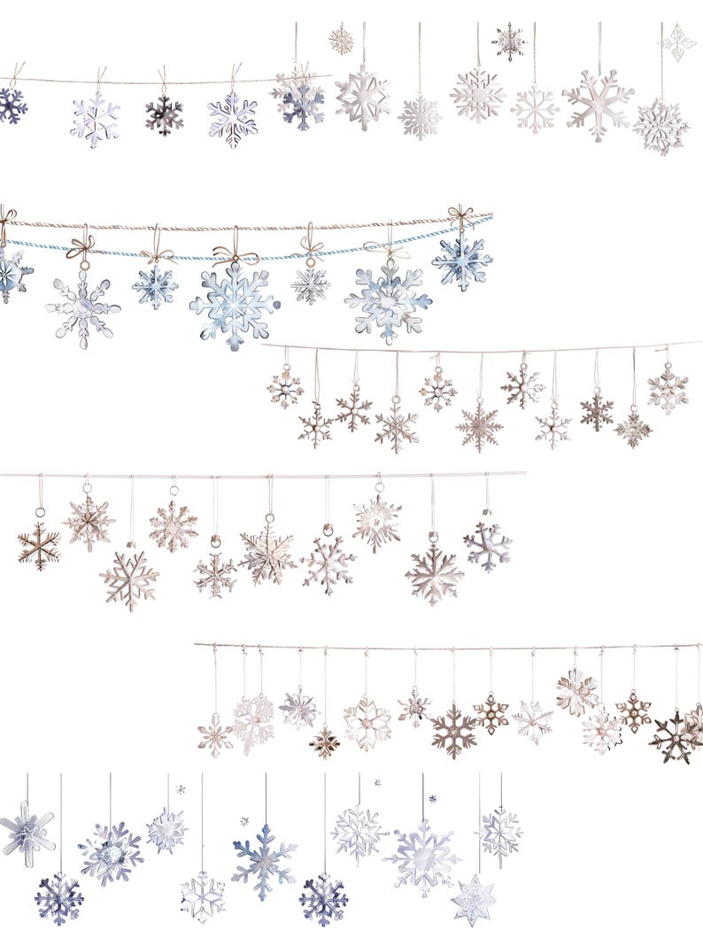 May include: A collection of hanging snowflake ornaments in various sizes and designs. The snowflakes are silver, white, and light blue, suspended by thin strings. Some are tied with small bows. The background is plain white.
