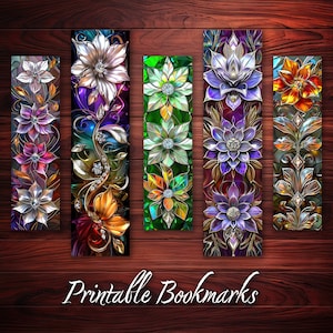 May include: Five printable bookmarks featuring colourful, ornate floral designs with jeweled accents. The bookmarks are arranged horizontally on a woodgrain background. The text "Printable Bookmarks" is displayed below the bookmarks.