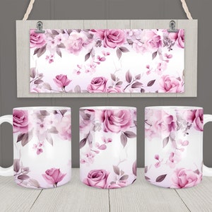 May include: Three white ceramic mugs with a pink floral pattern. The mugs have a white handle and are filled with a white liquid.