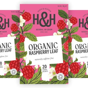 May include: Three boxes of Heath & Heather Organic Raspberry Leaf herbal tea. Each pink box features illustrations of red raspberries and white flowers, with the text H&H Herbal Wisdom, Organic Raspberry Leaf, naturally caffeine-free, and 20 herbal sachets.