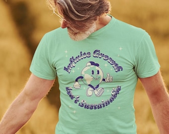 May include: A person wearing a light green t-shirt with a cartoon earth graphic and the text "Infinite Growth, It's Sustainable". The person is standing in a field of tall grass.