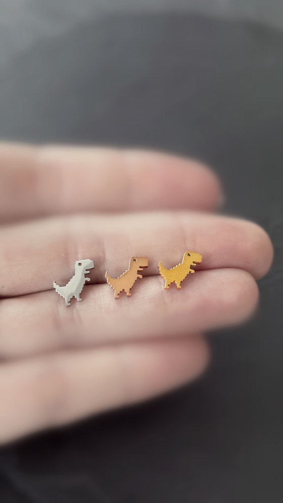 T-Rex rawr ohrstecker paar ohrring Schmuck Dino Dinosaurier Tier mit Hintergrund game over retro chrome