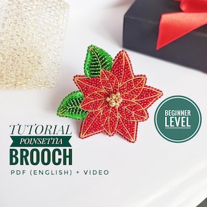 May include: A handmade poinsettia brooch with red and gold beads, green beaded leaves, and a gold center. The brooch is part of a tutorial, with the text "Tutorial Poinsettia Brooch PDF (English) + Video" and "Beginner Level".