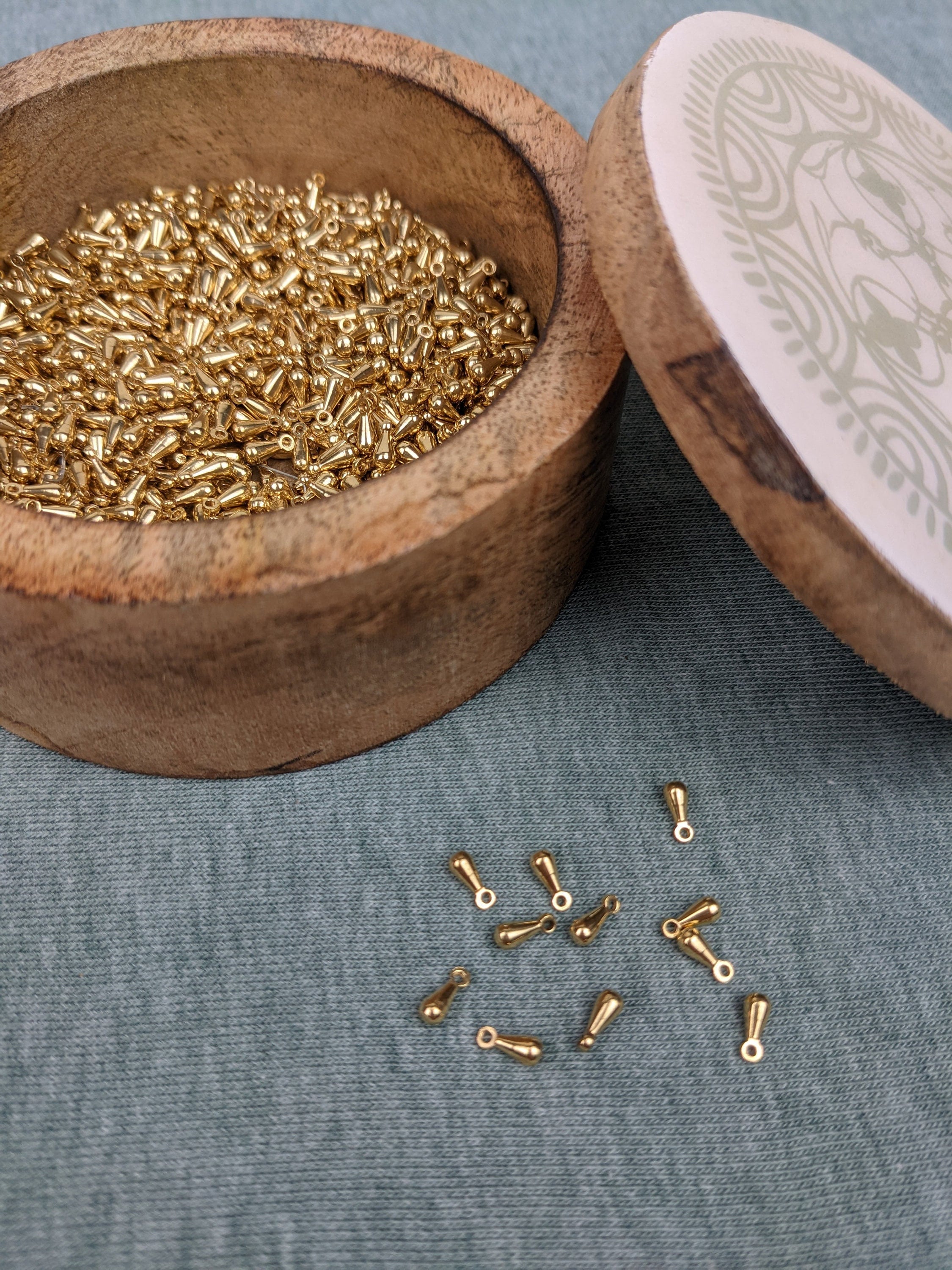 Golden mini drops 2.7 mm * 6.7 mm hole thickness 1.1 mm made of brass drop spacer bead for DIY jewelry making from India
