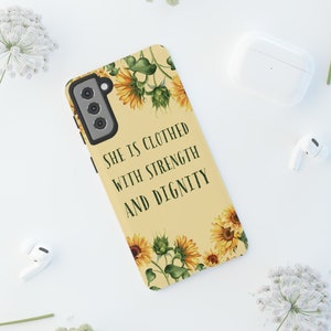 May include: A yellow phone case with a sunflower design and the text "She is clothed with strength and dignity".