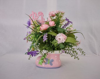 Girl Baby Shower Centerpiece with pink roses, pink, purple, and yellow wildflowers in a pink baby bootie vase. Glittery "Its a Girl" sign.