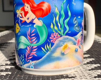 Unused Vintage 11.5 floz DISNEY’S “The Little Mermaid-1989” Vibrant Ceramic Mug Made in Thailand Exclusive to “Disney Theme Parks & Resorts”
