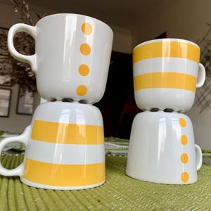 Unused Pairs/2 of Discont’d 8 fl oz IKEA “Ungdom” Modernist White Stoneware Mugs w/Yellow Geometric Patterns Designed by Maria Vinka #15199
