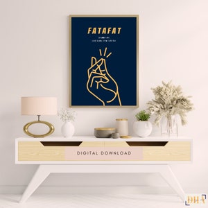 May include: A digital download print with a dark blue background and a yellow outline of a hand snapping its fingers. The text "FATAFAT" is in yellow and the text "(hurry up)  jaida kore, time nahi hai" is in white.