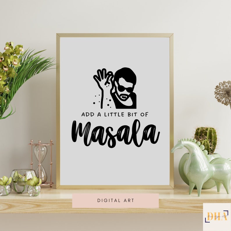 May include: A black and white digital art print featuring a silhouette of a person sprinkling masala with the text "Add a little bit of masala" below. The print is framed in a gold frame and is displayed on a wooden shelf.