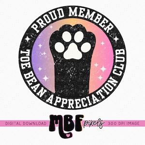 May include: A black and white paw print with a white paw pad in the center. The paw print is inside a circle with a pink, orange, and purple gradient background. The circle has the text "PROUD MEMBER TOE BEAN APPRECIATION CLUB" around the outside.