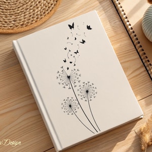May include: A white journal with a black dandelion design and butterflies flying away. The journal has a simple, elegant design.