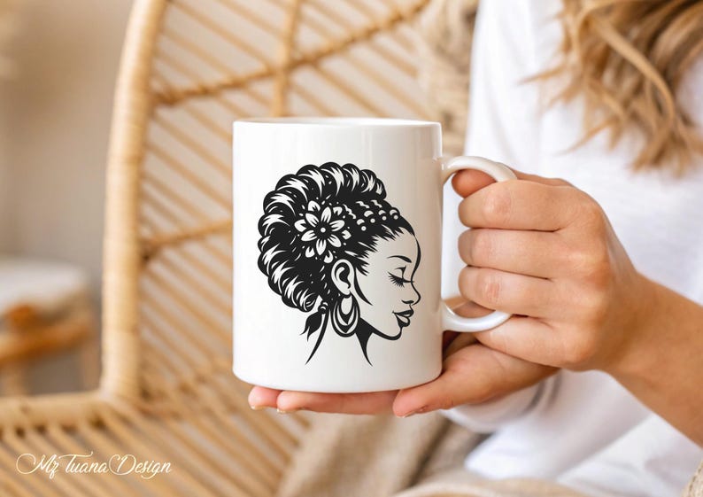 May include: White ceramic mug with a black and white illustration of a woman with a flower in her hair. The woman is looking to the right.
