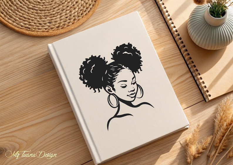 May include: Black and white silhouette of a woman with two large afro puffs and large hoop earrings. The woman is looking down and to the right.