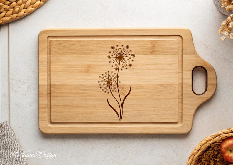May include: A wooden cutting board with a handle, featuring a laser-engraved design of two dandelions.