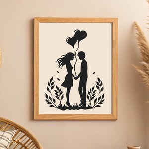 May include: Black and white silhouette print of a couple holding hands with two heart-shaped balloons. The couple is standing in front of a leafy design.