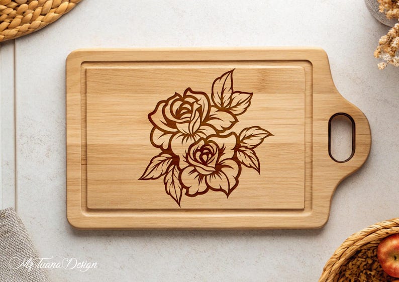 May include: A wooden cutting board with a brown floral design of roses engraved on the surface. The board has a handle on the side.