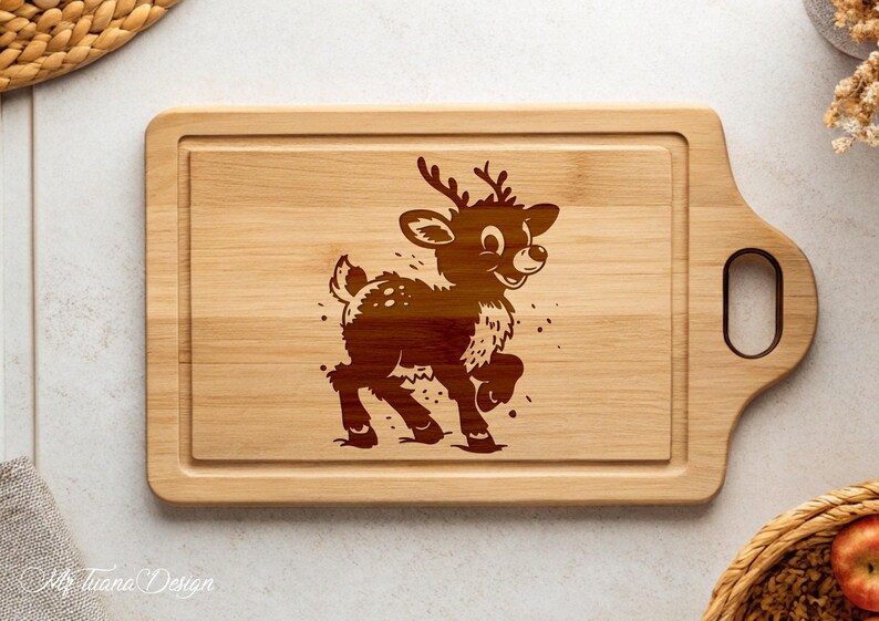May include: A wooden cutting board with a brown reindeer design engraved on the surface. The board has a handle on the side.