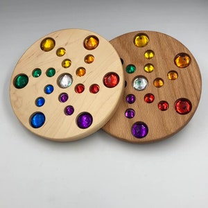 Gem Spinners / gems / colour recognition / crossing the midline / wooden toys / open ended play / imaginative play / physical coordination