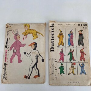 May include: Two vintage sewing patterns for children's costumes. One pattern features a bunny, cheetah, and penguin costume. The other pattern shows various clown costumes. The patterns are printed on aged paper with illustrations of the finished costumes.
