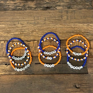 Houston Astros bead bracelet stack. Cheer on the Astros and show your H-Town pride! Go Stros!