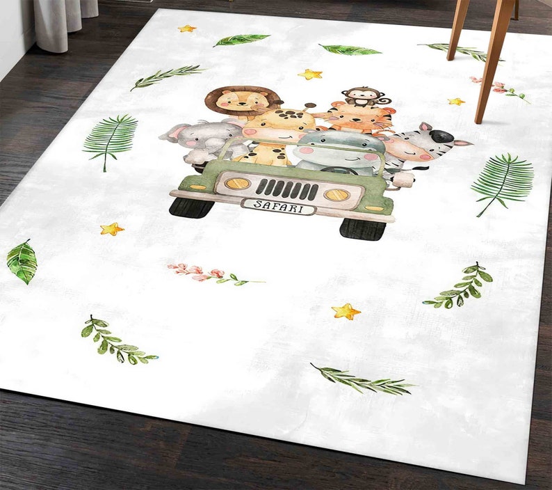 May include: A white rug with a green jeep carrying a group of safari animals. The animals include a giraffe, a zebra, a monkey, a hippopotamus, a lion, and a tiger. The jeep has the word "SAFARI" written on the license plate. The rug is decorated with green leaves and yellow stars.