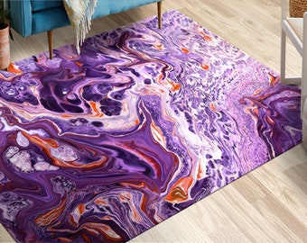 May include: Abstract area rug with a purple, orange and white swirling pattern. The rug has a modern, contemporary design.