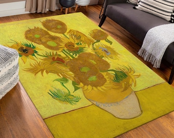 May include: A yellow and brown rug with a painting of sunflowers in a vase. The sunflowers are yellow and brown with green leaves. The vase is white with a yellow rim.