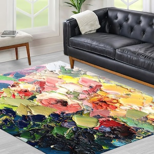 May include: Abstract floral rug with a colorful, textured design. The rug features shades of pink, yellow, green, blue, and red.