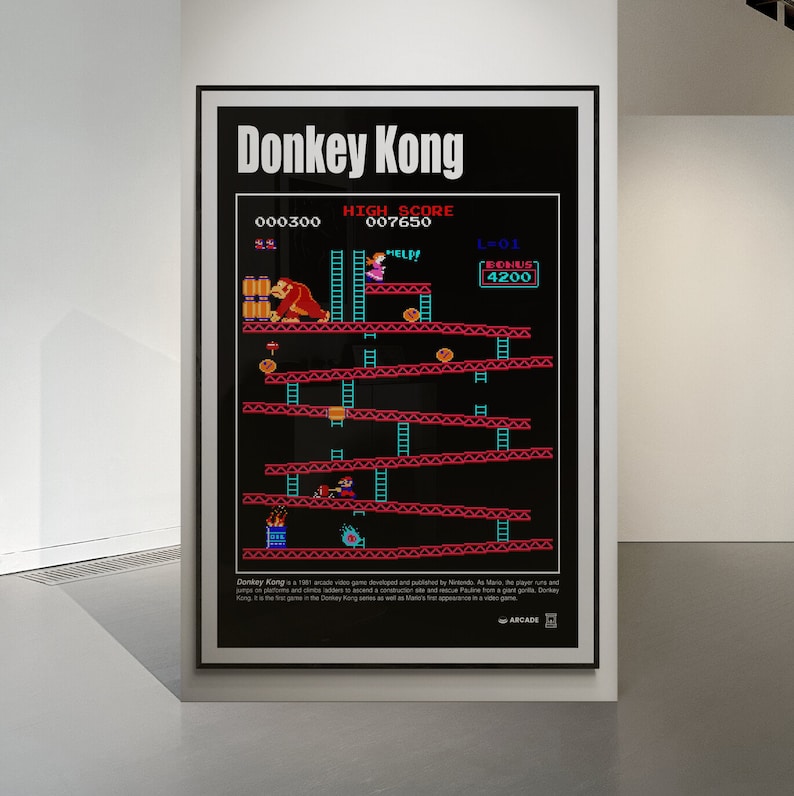 May include: A vintage poster of the classic arcade game Donkey Kong. The poster features a black background with a red and blue game screen showing Donkey Kong, Mario, and Pauline. The text "Donkey Kong" is at the top of the poster in white letters. The text "HIGH SCORE" and "BONUS" are also visible on the poster.