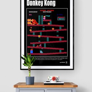 May include: A black and red poster with the title "Donkey Kong" and a screenshot of the classic arcade game. The poster features the characters Mario, Donkey Kong, and Pauline. The score is 000300, the high score is 007650, and the bonus is 4200.